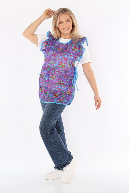 Floral pinafore apron with ruffle, two side pockets, tie-back fastening