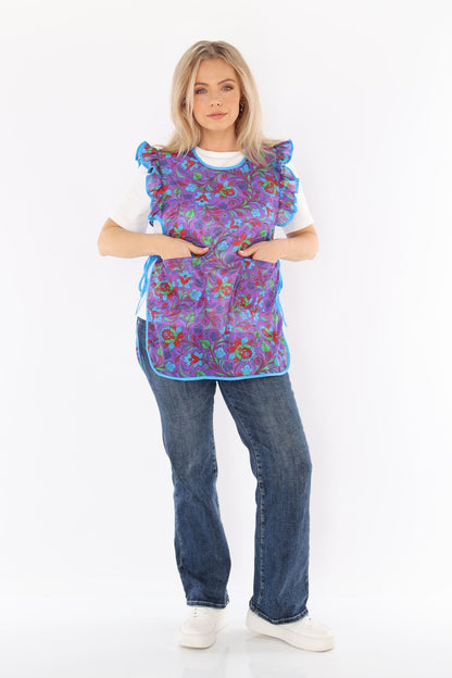 Floral pinafore apron with ruffle, two side pockets, tie-back fastening