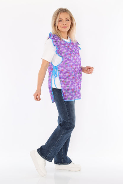 Floral pinafore apron with ruffle, two side pockets, tie-back fastening