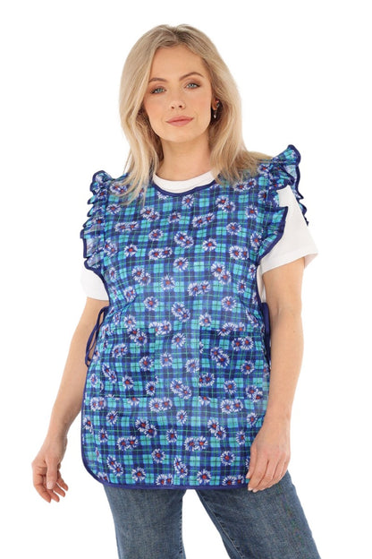 Floral pinafore apron with ruffle, two side pockets, tie-back fastening