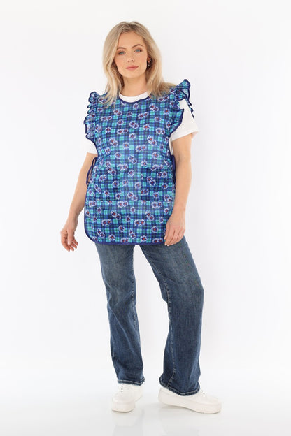 Floral pinafore apron with ruffle, two side pockets, tie-back fastening