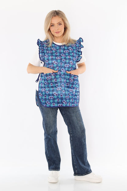 Floral pinafore apron with ruffle, two side pockets, tie-back fastening