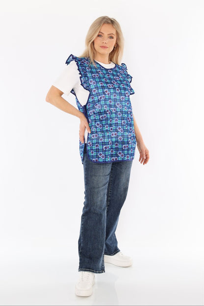 Floral pinafore apron with ruffle, two side pockets, tie-back fastening