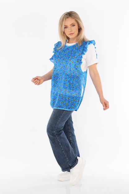 Floral pinafore apron with ruffle, two side pockets, tie-back fastening