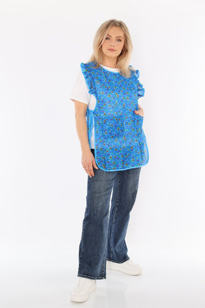 Floral pinafore apron with ruffle, two side pockets, tie-back fastening