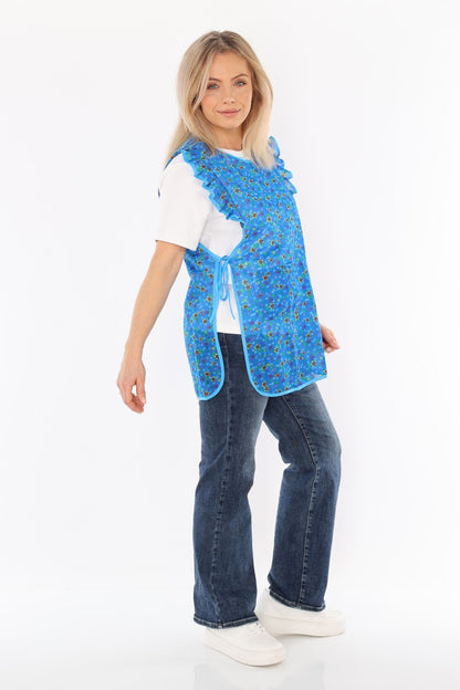 Floral pinafore apron with ruffle, two side pockets, tie-back fastening