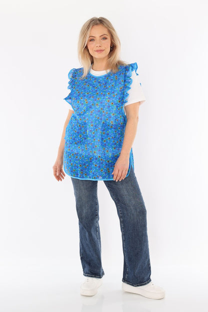 Floral pinafore apron with ruffle, two side pockets, tie-back fastening