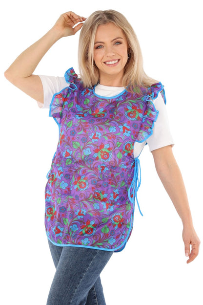 Floral pinafore apron with ruffle, two side pockets, tie-back fastening